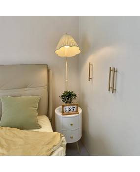 Living room sofa next to coffee table shelf floor lamp ins cream style bedroom with bedside table drawer integrated light